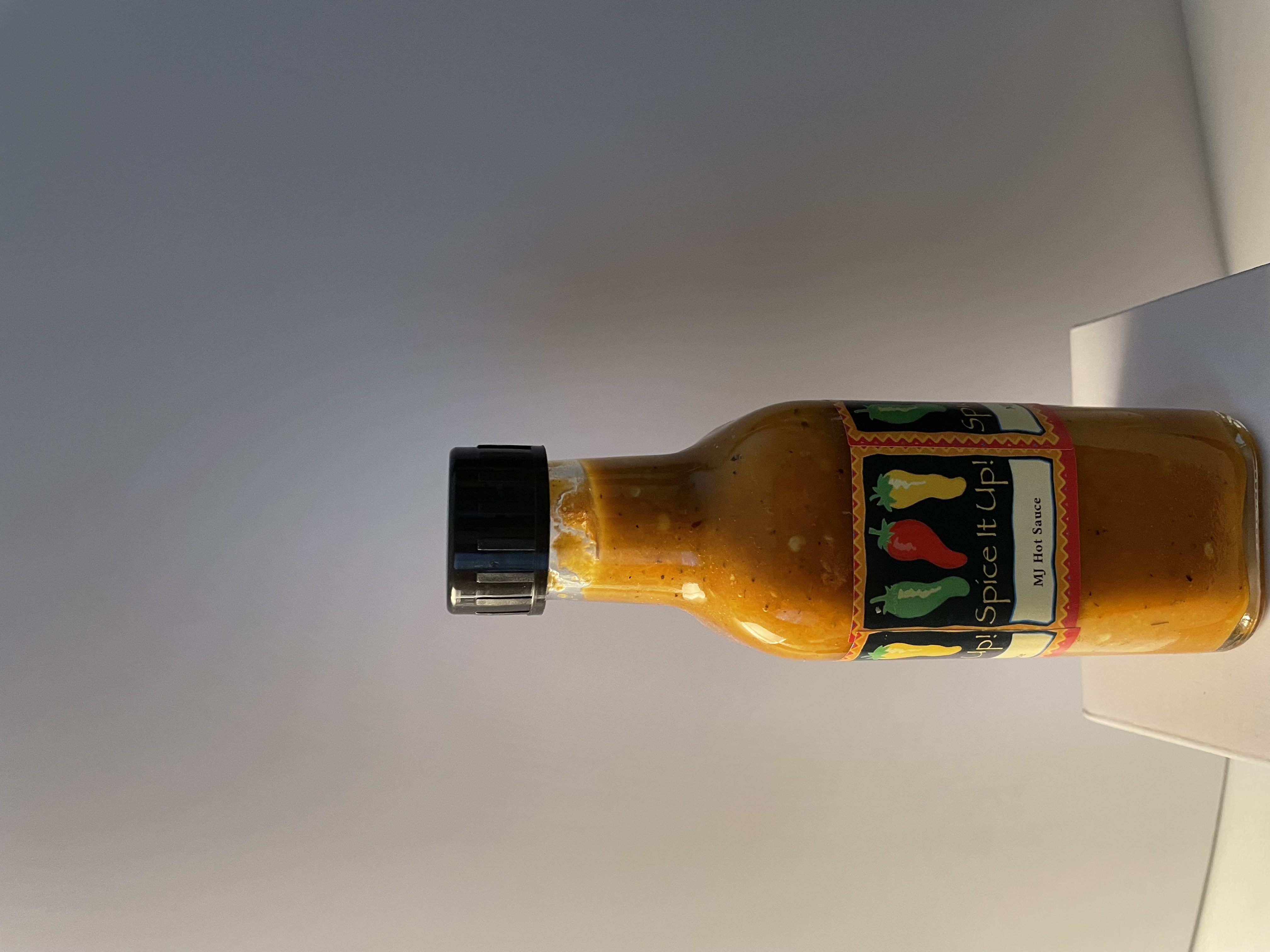 MJ's Original Caribbean Hot Sauce bottle with tropical label design